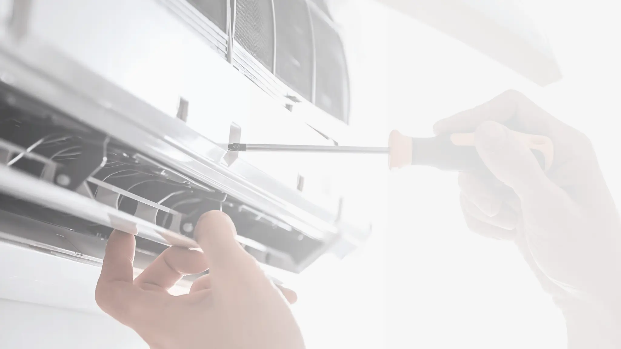 Be Cool engineer servicing an air conditioning unit